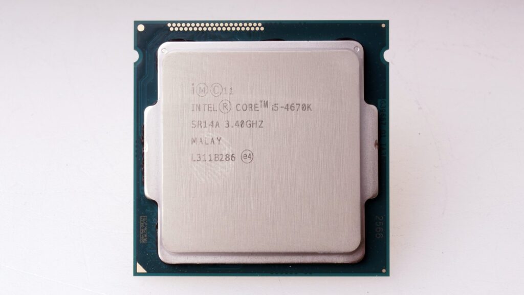 Close-up photograph of the Intel Core i5-4670K Haswell processor, showing its metal heat spreader, model identification